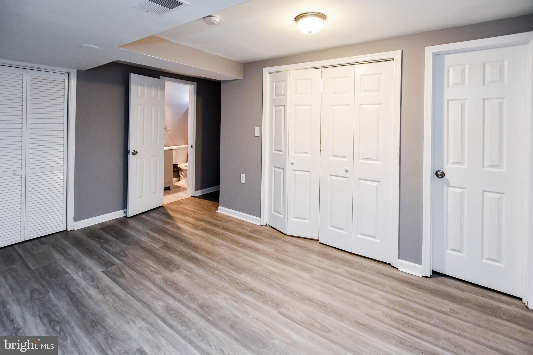 1028 Evesham Avenue Baltimore, MD 21212 - Photo 44 of 49 a view of empty room with wooden floor