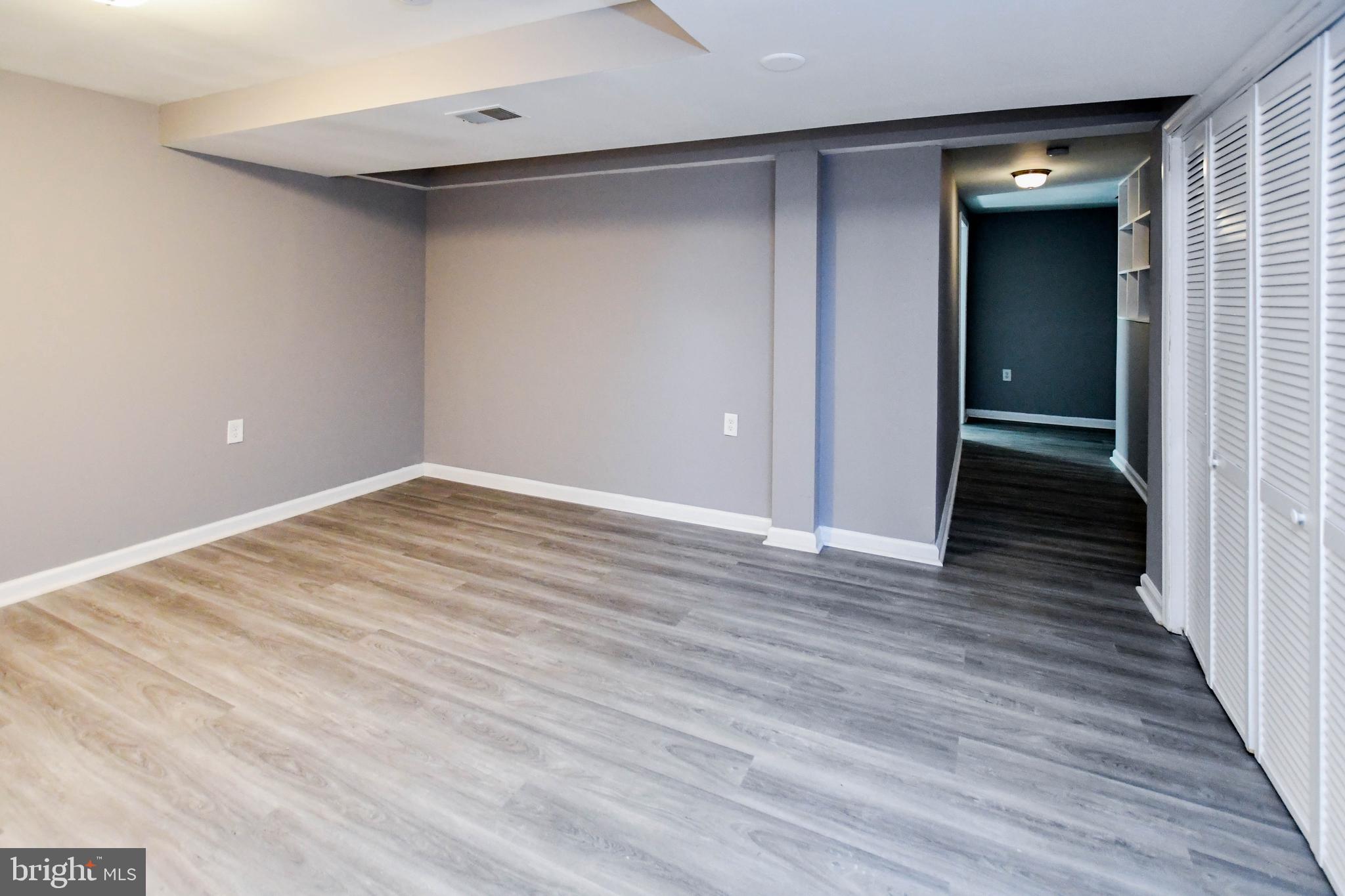 1028 Evesham Avenue Baltimore, MD 21212 - Photo 49 of 49 a view of an empty room with wooden floor