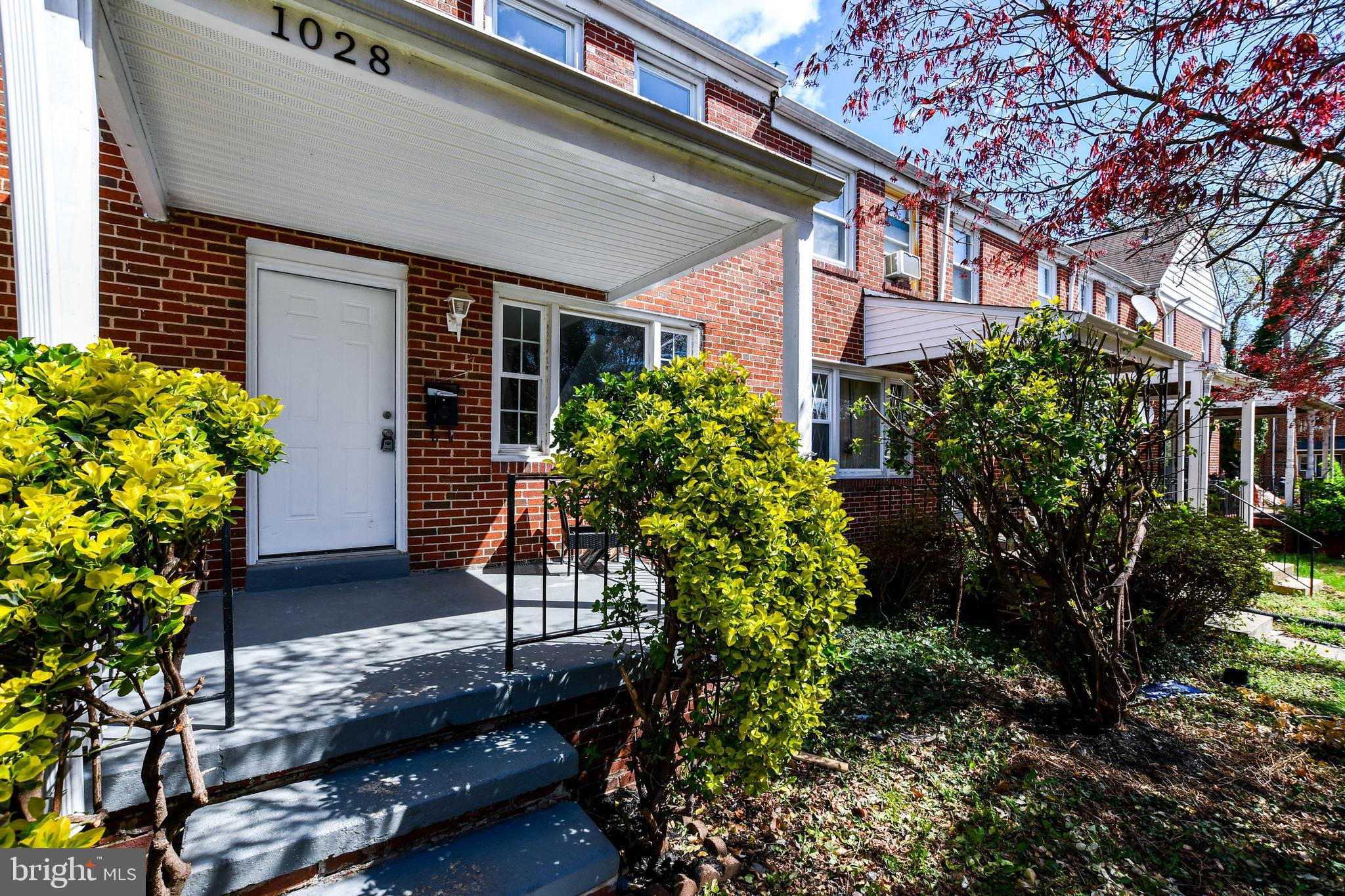1028 Evesham Avenue Baltimore, MD 21212 - Photo 5 of 49 a house with trees in front of it
