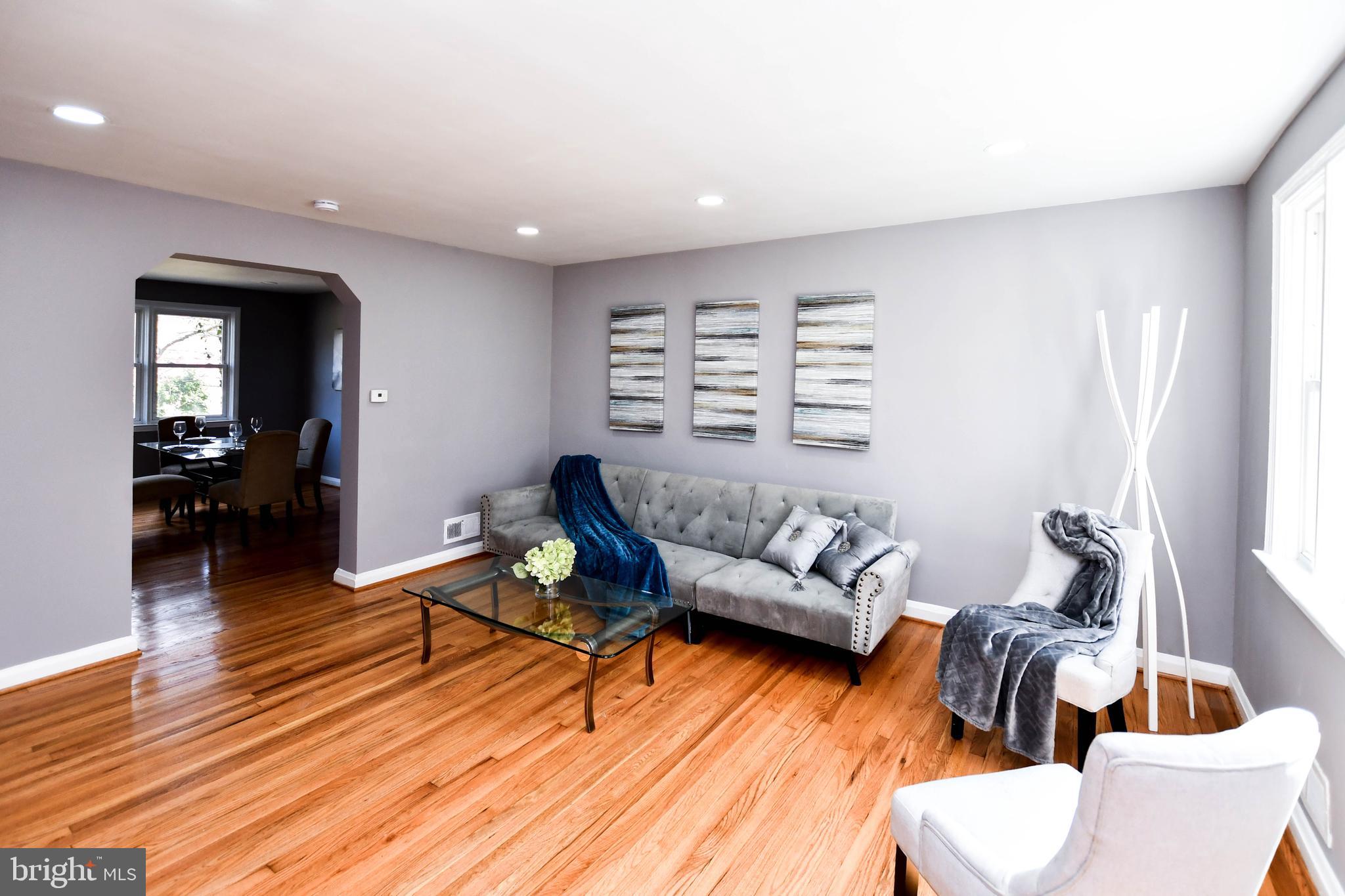 1028 Evesham Avenue Baltimore, MD 21212 - Photo 7 of 49 a living room with furniture and wooden floor