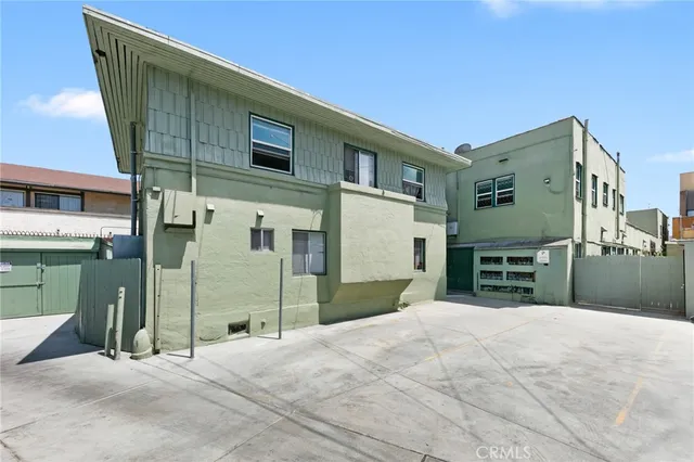 a view of a house with a backyard of a house