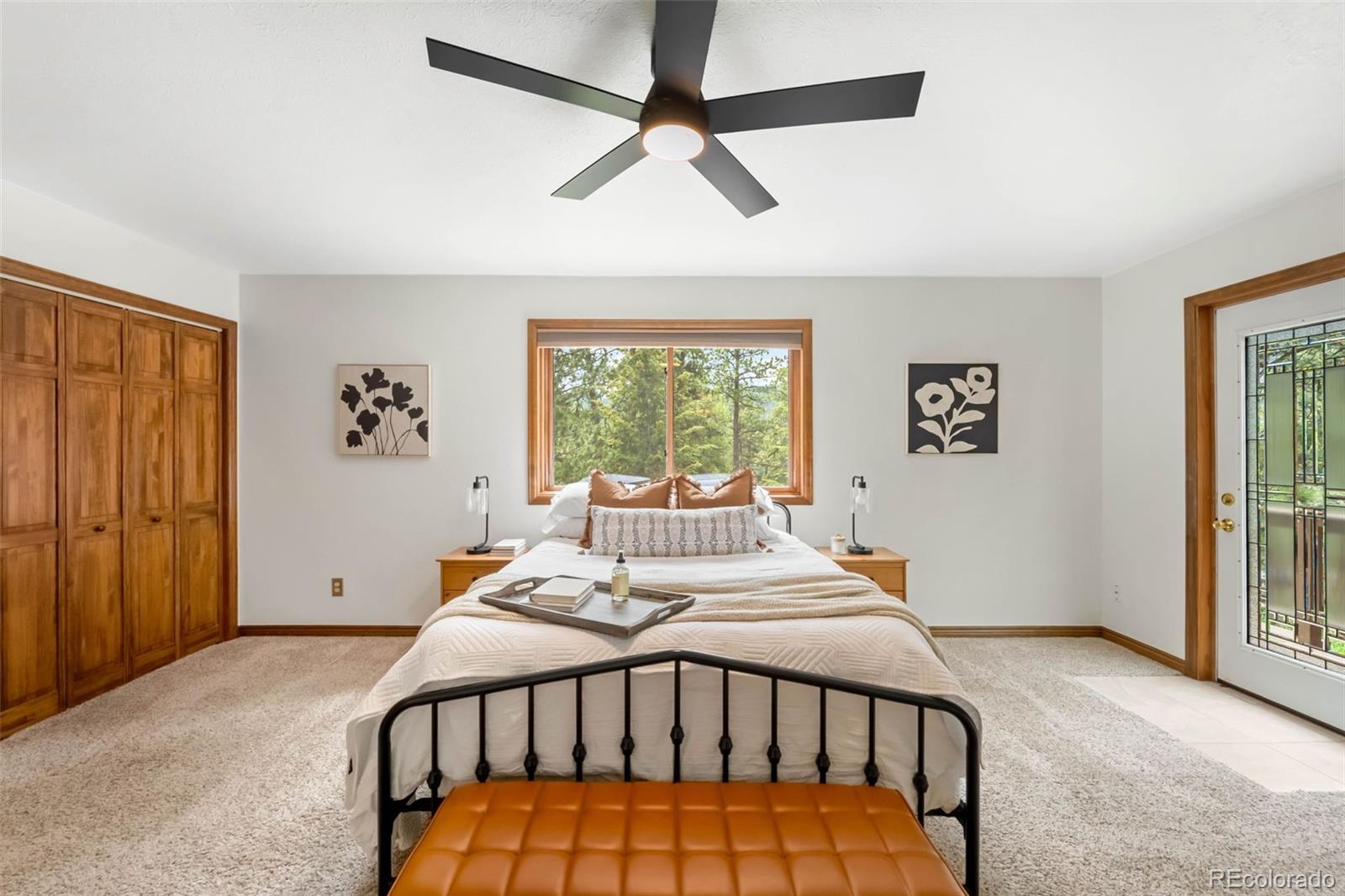 9633 Fox Valley Drive Morrison, CO 80465 - Photo 13 of 50 a bedroom with a bed and a window