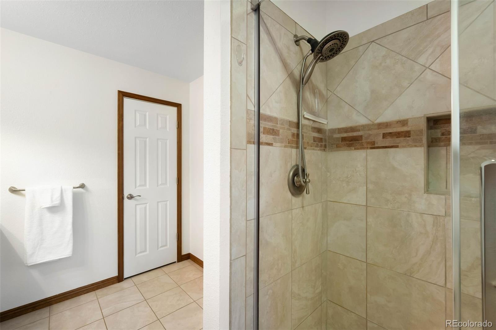 9633 Fox Valley Drive Morrison, CO 80465 - Photo 16 of 50 a bathroom with a shower