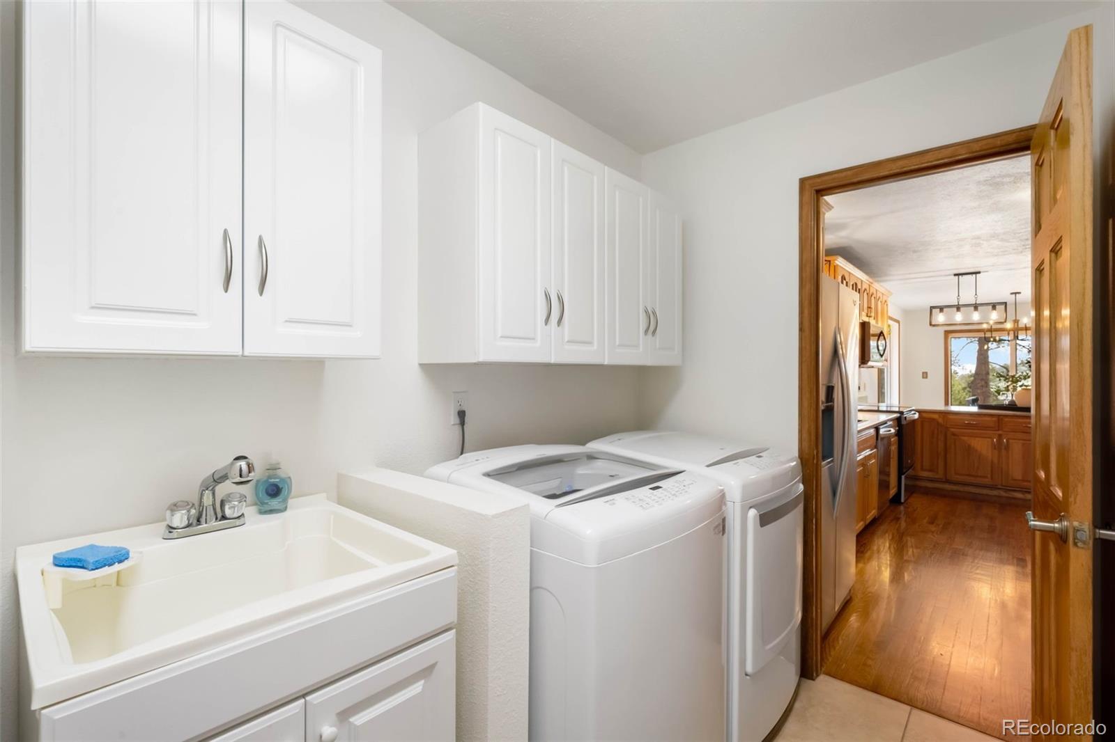 9633 Fox Valley Drive Morrison, CO 80465 - Photo 18 of 50 a utility room with dryer and washer