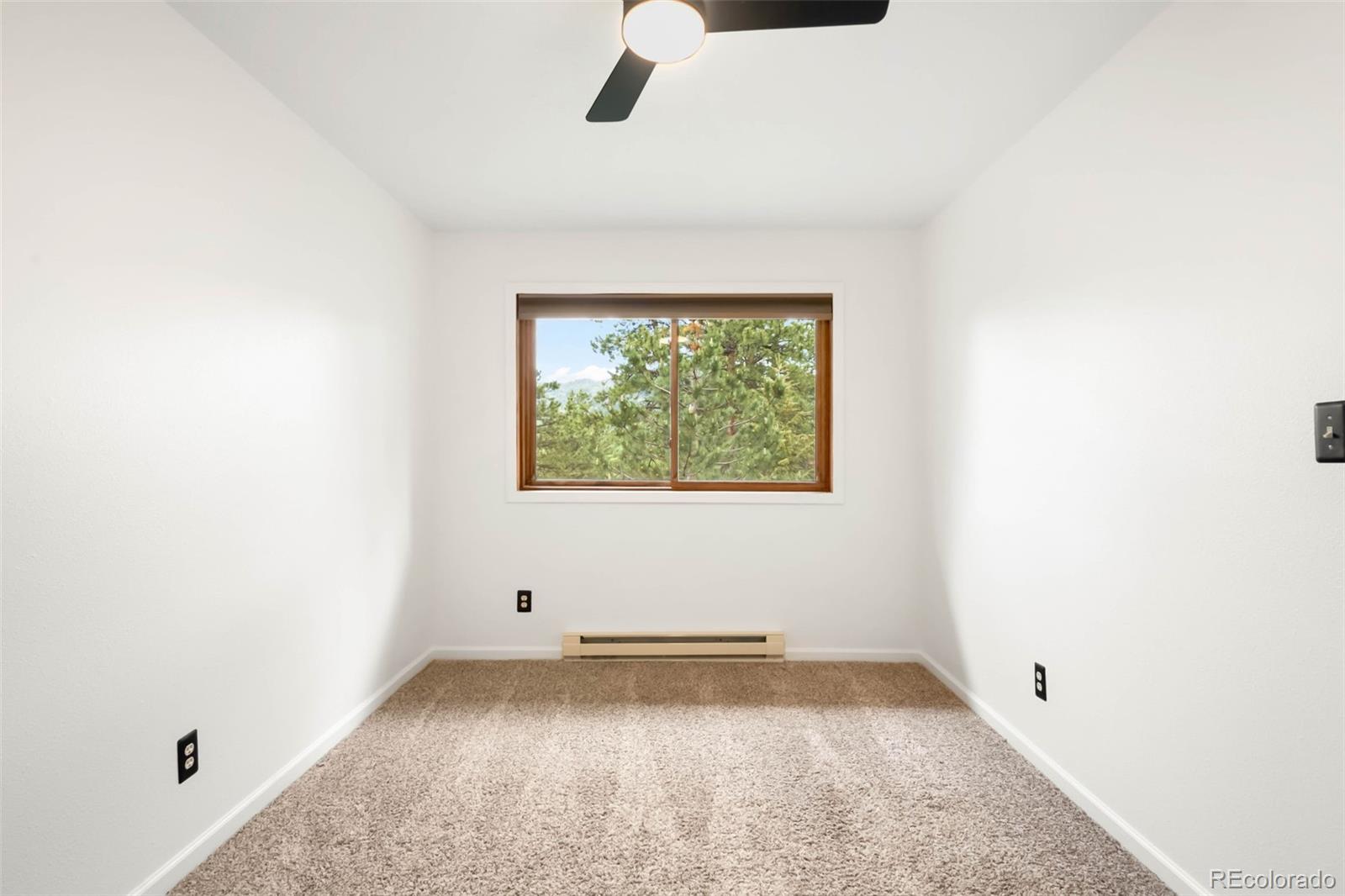 9633 Fox Valley Drive Morrison, CO 80465 - Photo 21 of 50 an empty room with a window