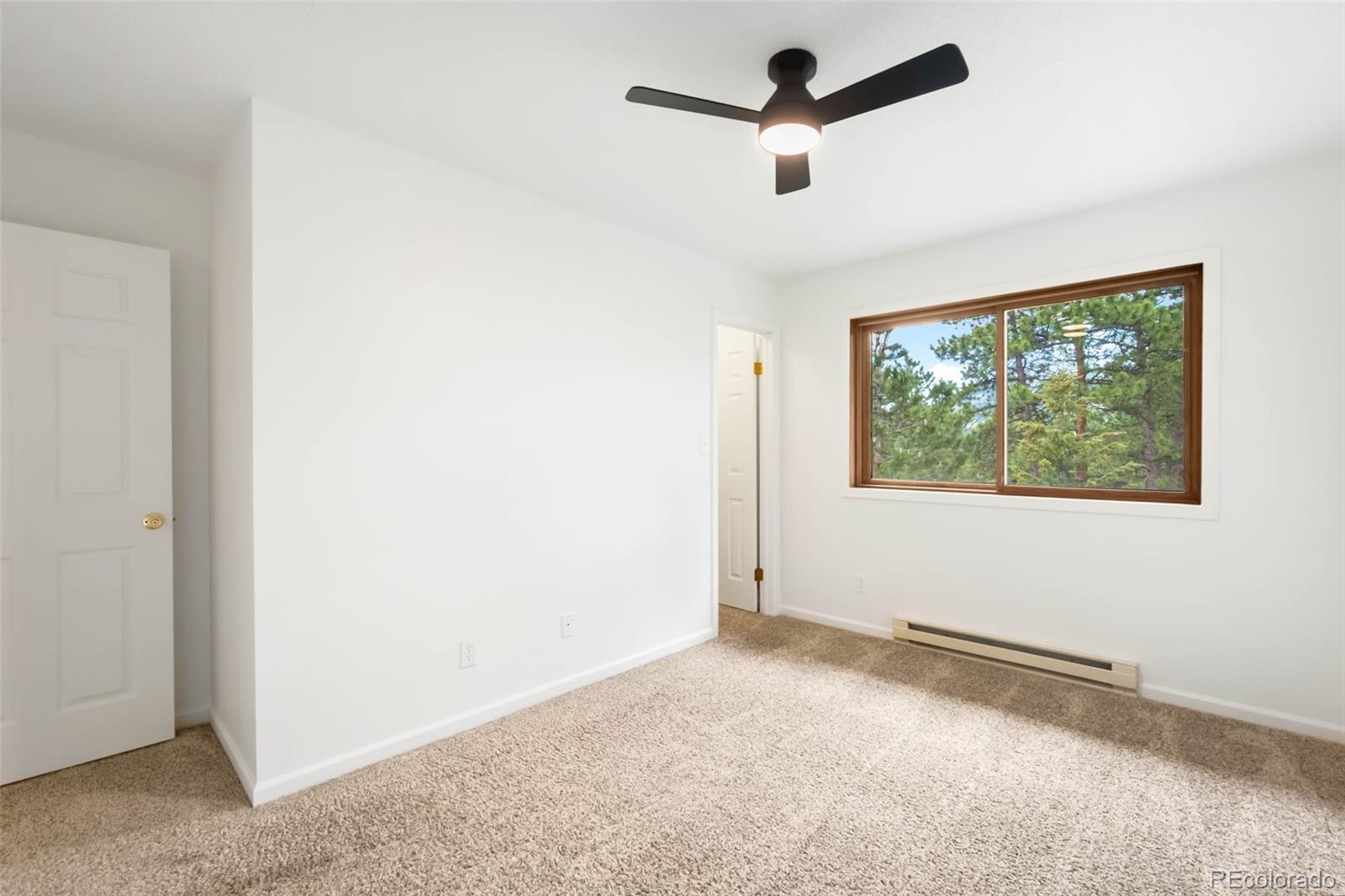 9633 Fox Valley Drive Morrison, CO 80465 - Photo 22 of 50 an empty room with a window