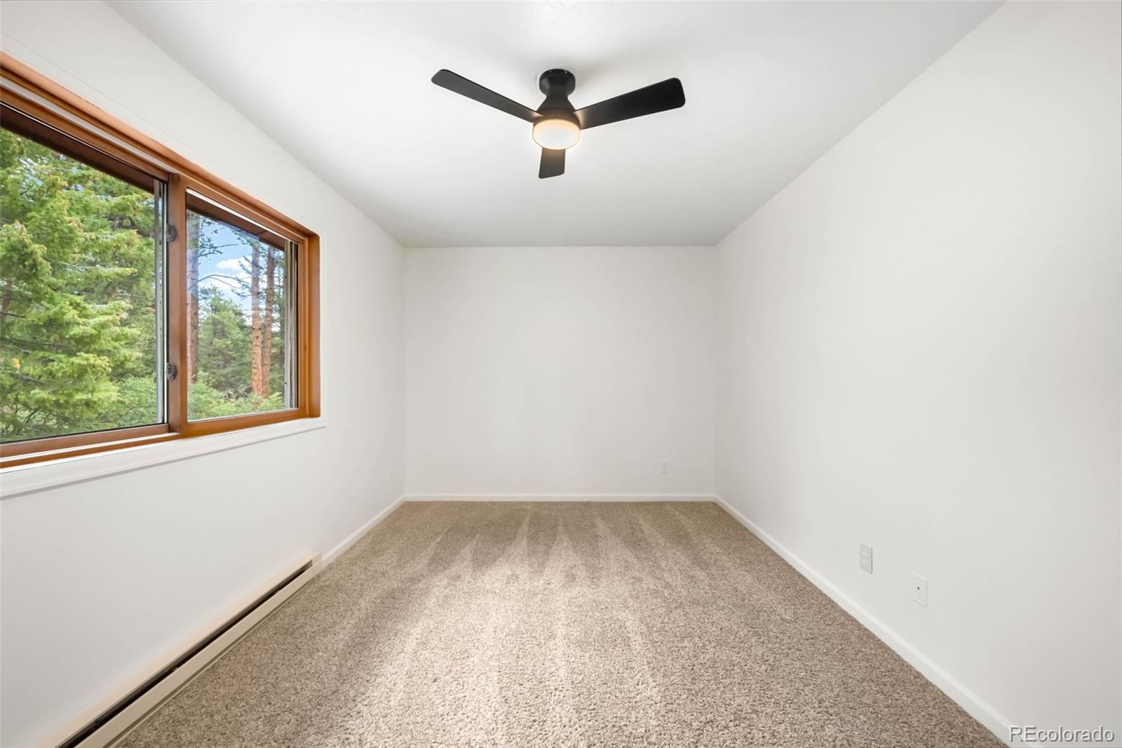 9633 Fox Valley Drive Morrison, CO 80465 - Photo 23 of 50 an empty room with a window