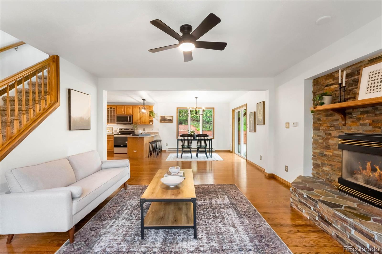 9633 Fox Valley Drive Morrison, CO 80465 - Photo 3 of 50 a living room with furniture and wooden floor