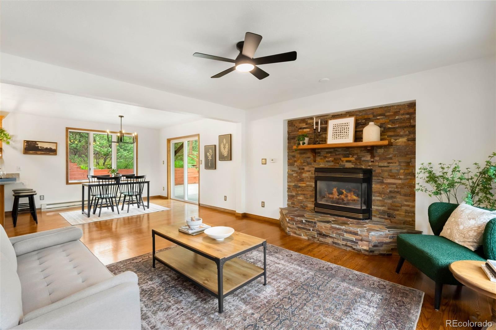 9633 Fox Valley Drive Morrison, CO 80465 - Photo 4 of 50 a living room with furniture and a fireplace