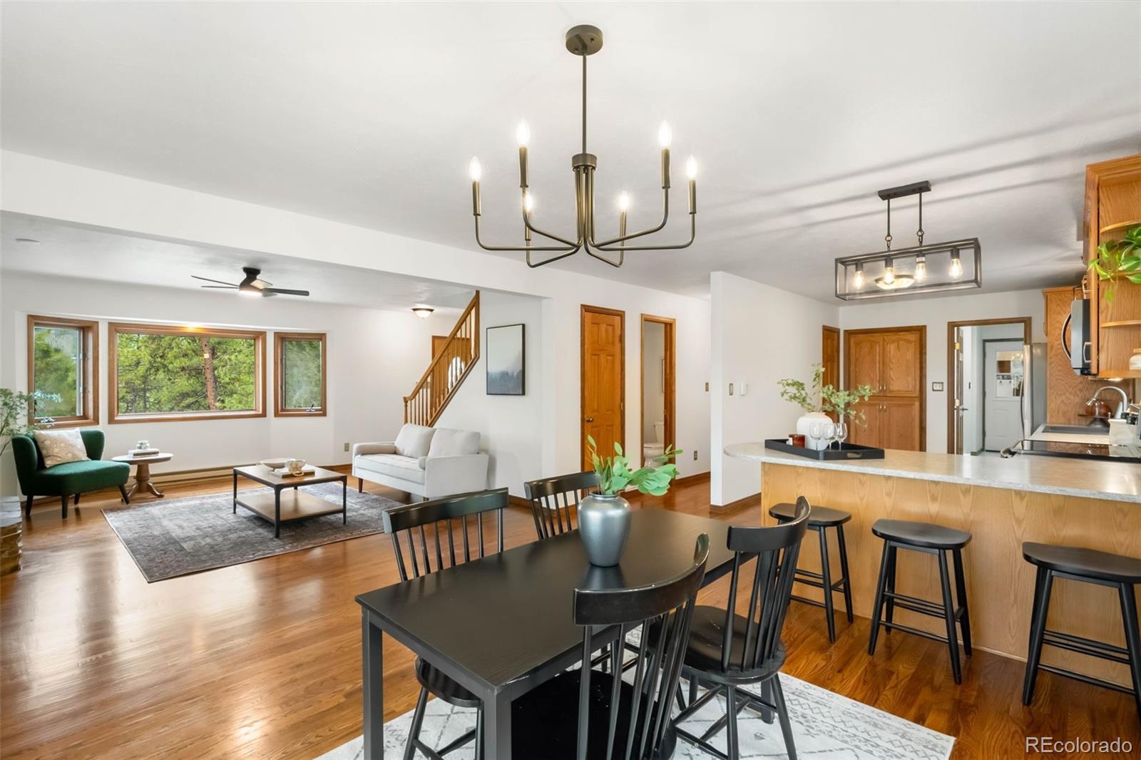 9633 Fox Valley Drive Morrison, CO 80465 - Photo 8 of 50 a very nice looking dining room with furniture window and wooden floor