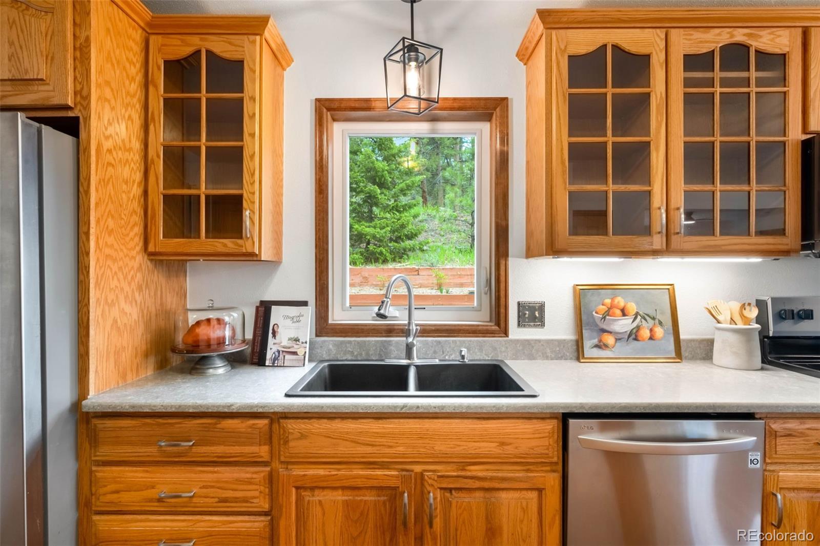 9633 Fox Valley Drive Morrison, CO 80465 - Photo 10 of 50 a kitchen with a sink and large window