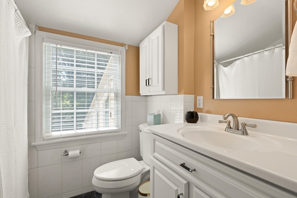 10 Prancing Road Chelmsford, MA 01824 - Photo 29 of 38 a bathroom with a sink a toilet and a window