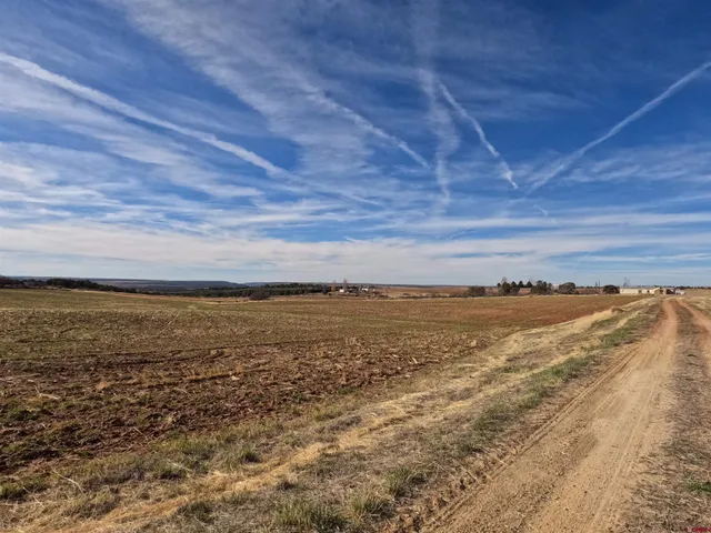 a kitchen with granite countertop a sink cabinets and stainless steel appliances