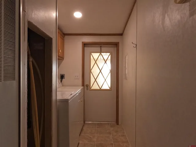 a living room with fireplace and windows