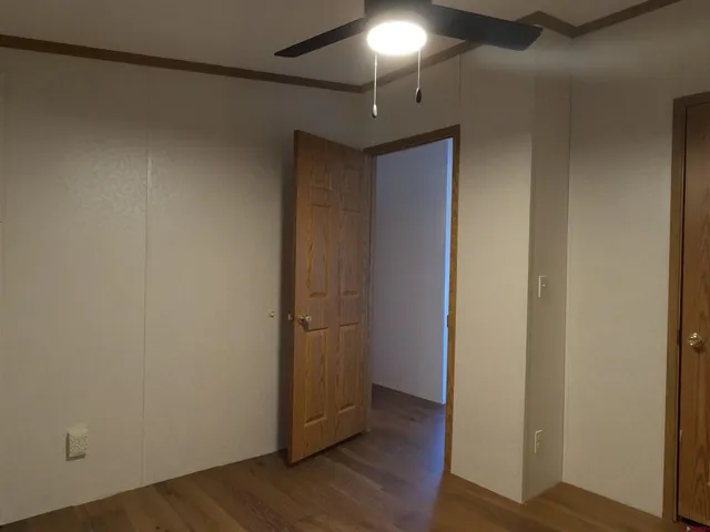 a view of front door with wooden floor
