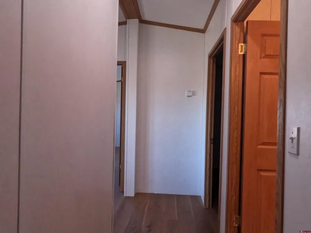 an empty room with wooden floor