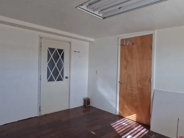 a view of a parking space with a garage