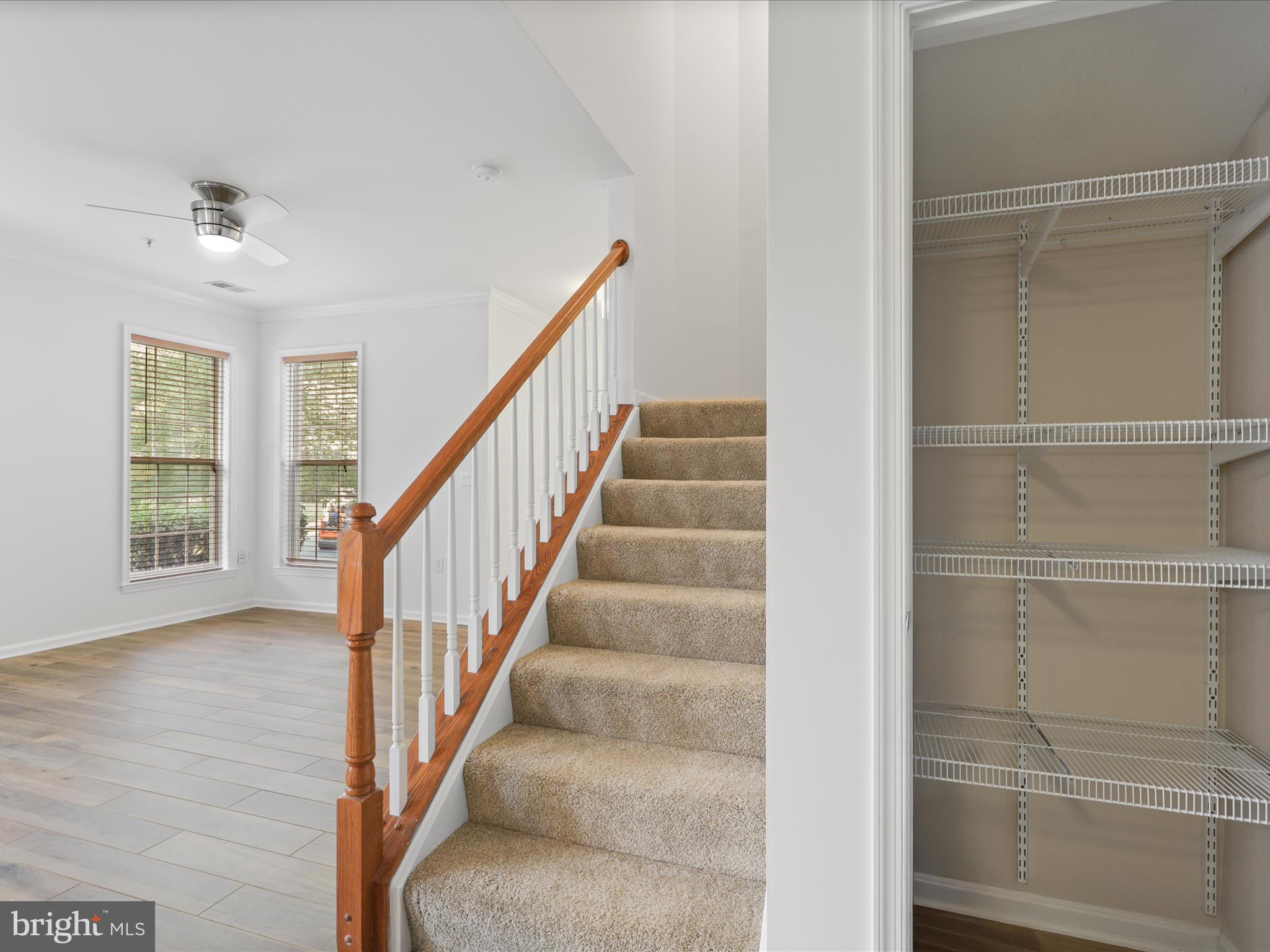 14592 Kylewood Way Gainesville, VA 20155 - Photo 15 of 60 a view of staircase with white walls and windows