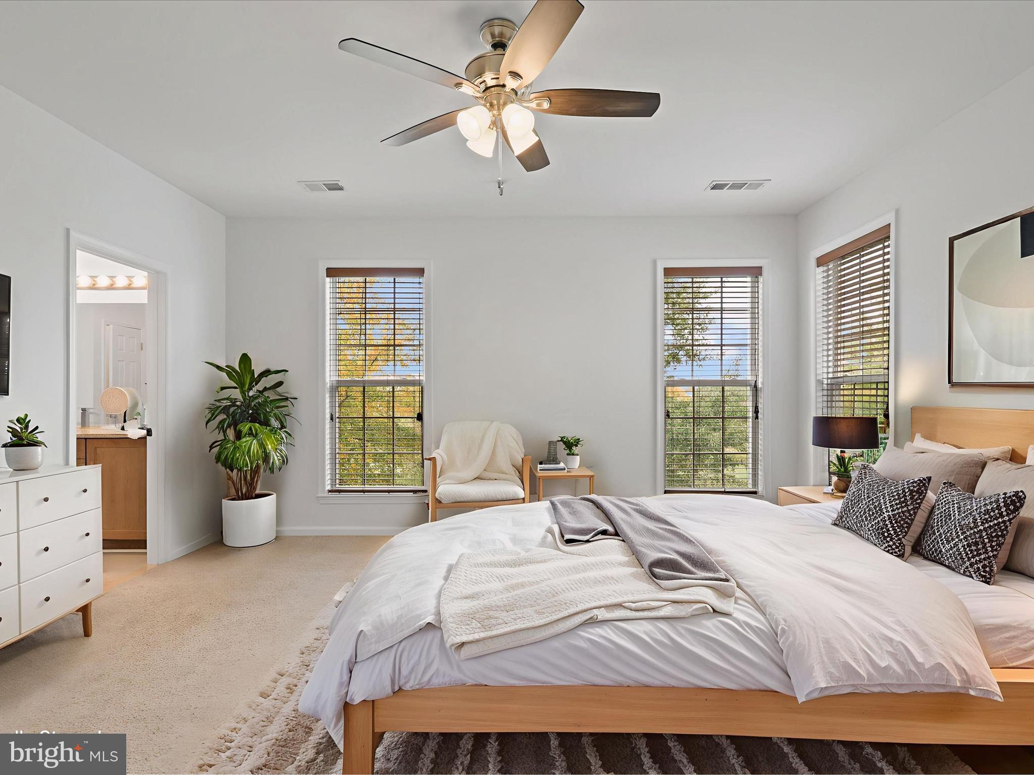 14592 Kylewood Way Gainesville, VA 20155 - Photo 17 of 60 a bedroom with a bed and ceiling fan