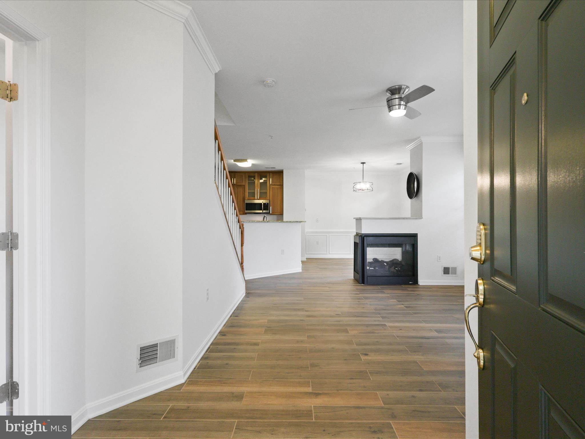 14592 Kylewood Way Gainesville, VA 20155 - Photo 3 of 60 a view of a livingroom with a fireplace