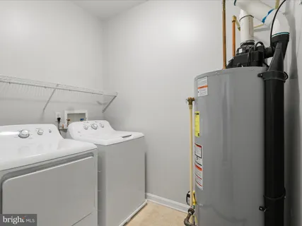 a front view of a house with plants