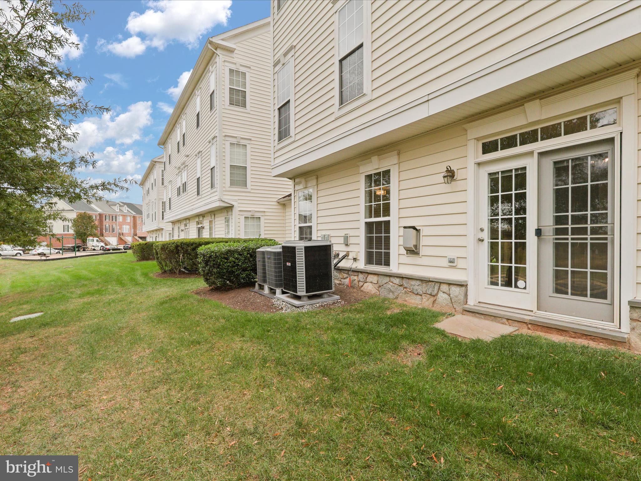 14592 Kylewood Way Gainesville, VA 20155 - Photo 38 of 60 a view of house with backyard and sitting area