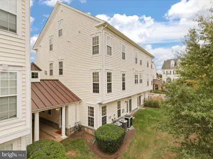 a view of a lake with houses in the back