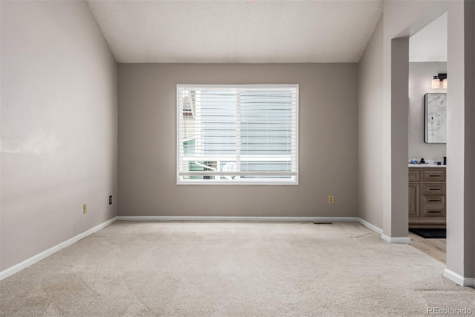 9407 Harvard Drive Highlands Ranch, CO 80130 - Photo 15 of 48 a view of an empty room with a window