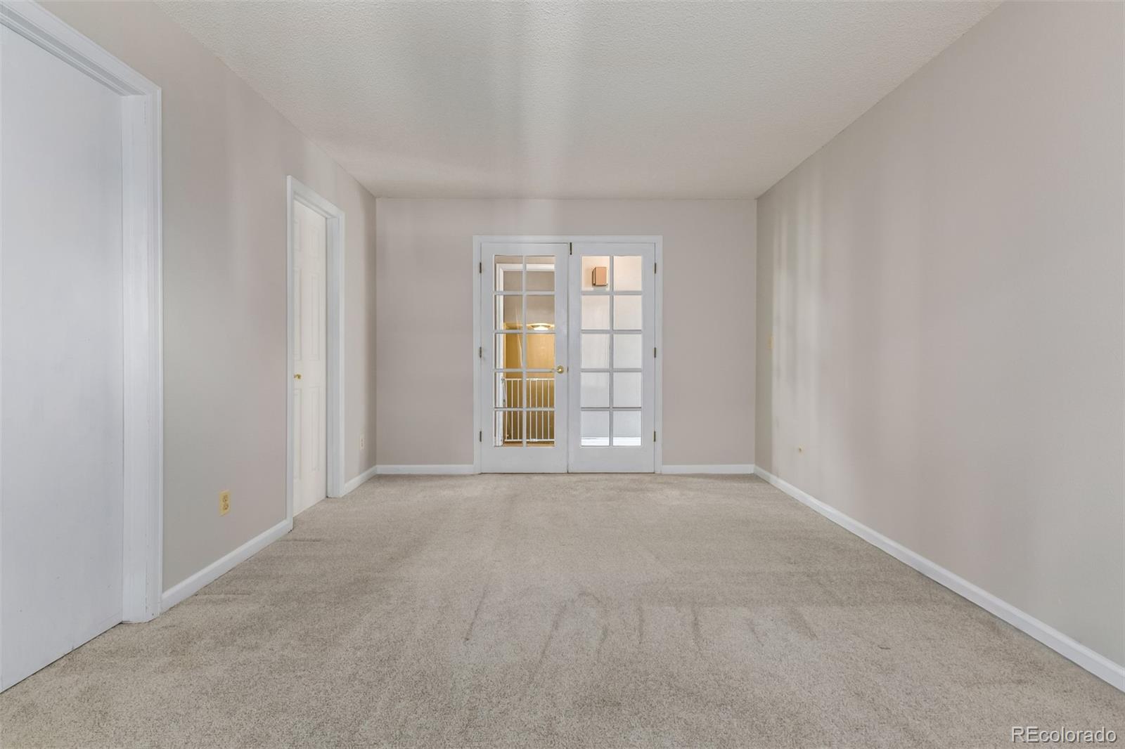 9407 Harvard Drive Highlands Ranch, CO 80130 - Photo 25 of 48 a view of an empty room with a window