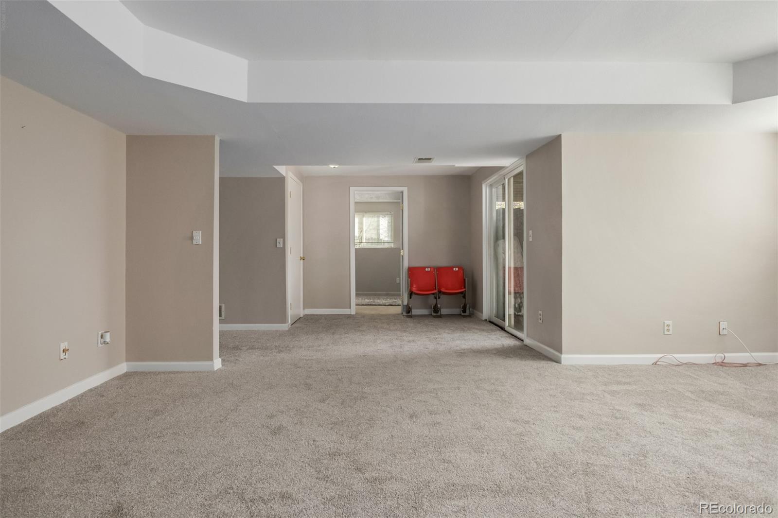 9407 Harvard Drive Highlands Ranch, CO 80130 - Photo 30 of 48 a view of a room with furniture and a fan