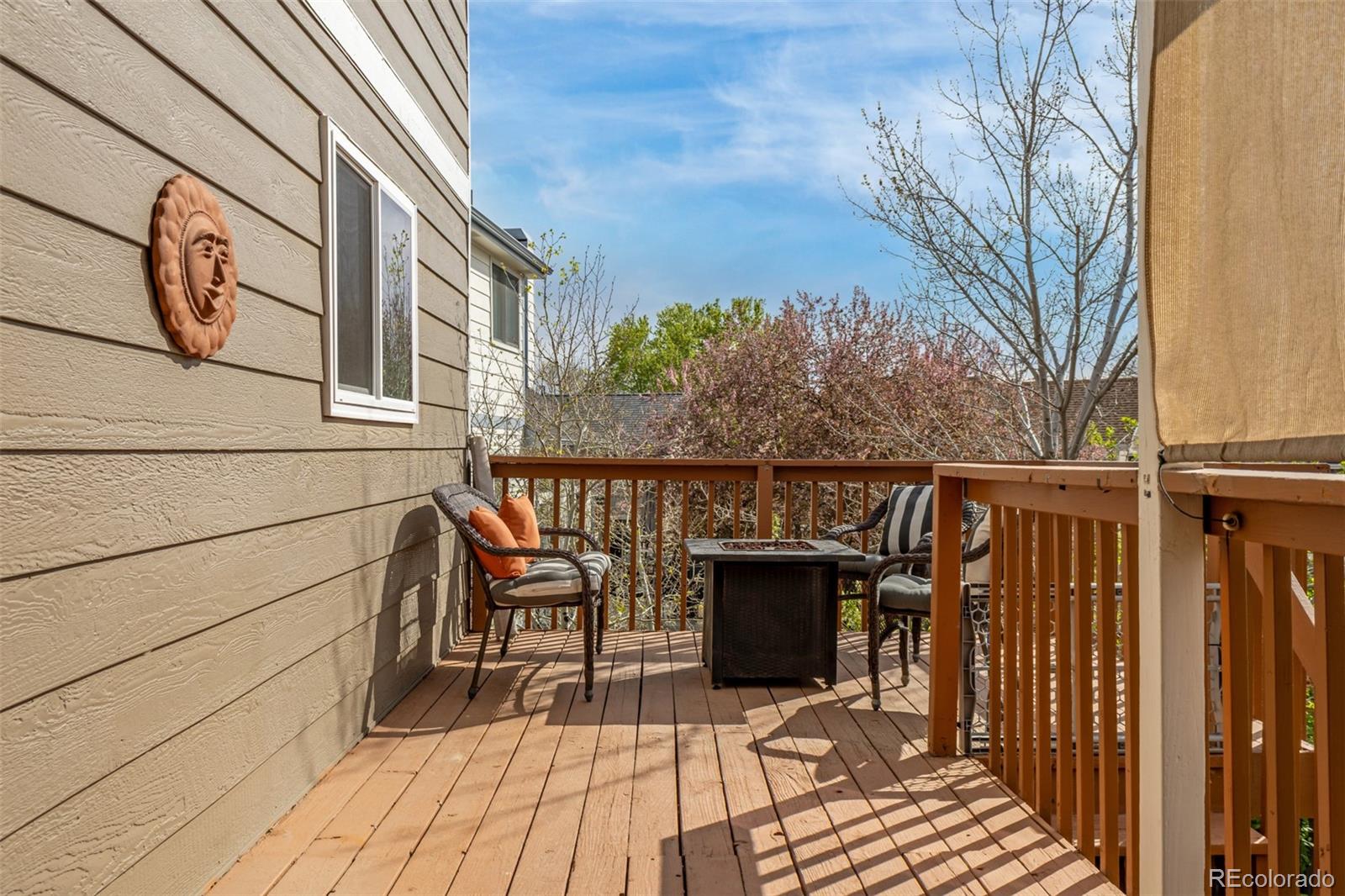 9407 Harvard Drive Highlands Ranch, CO 80130 - Photo 39 of 48 a balcony with wooden floor and furniture
