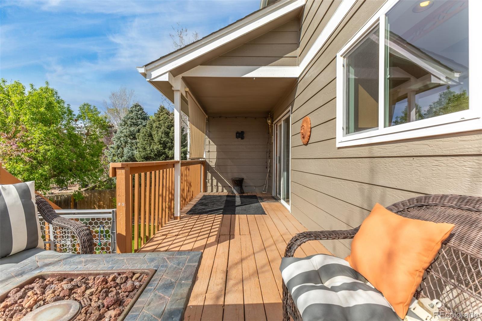 9407 Harvard Drive Highlands Ranch, CO 80130 - Photo 40 of 48 a view of balcony with wooden floor and seating space