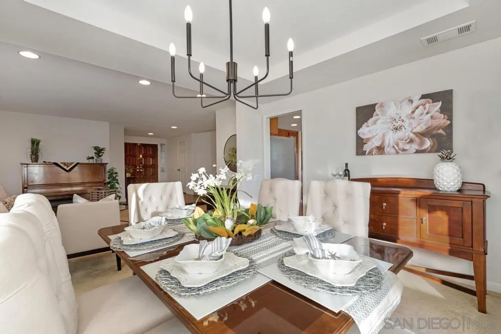 1545 Calle Ryan Encinitas, CA 92024 - Photo 23 of 63 a living room with furniture a couch and a chandelier