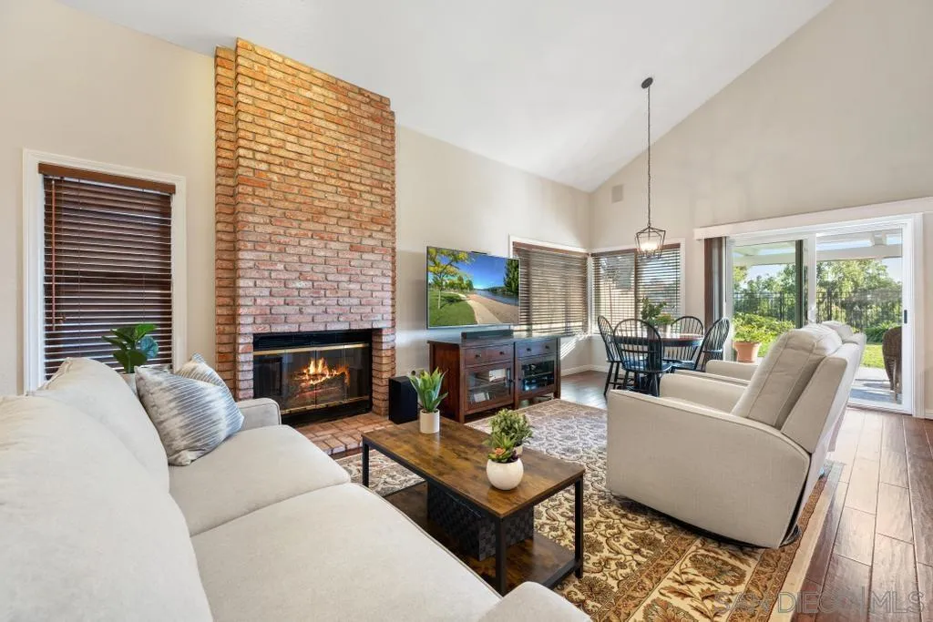 1545 Calle Ryan Encinitas, CA 92024 - Photo 24 of 63 a living room with furniture fireplace and a large window