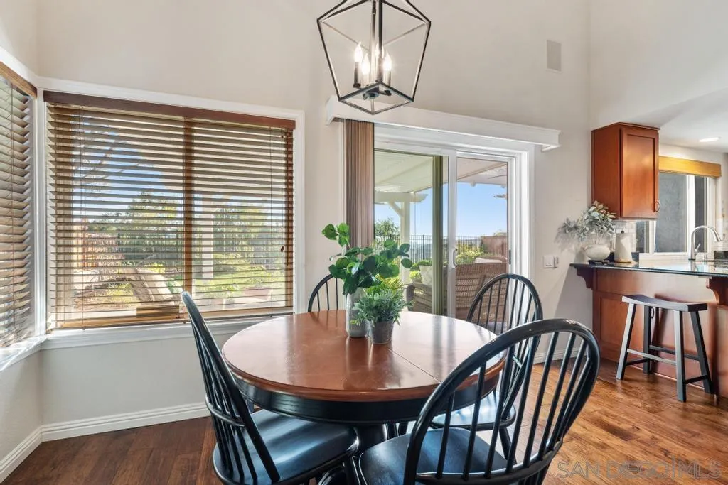 1545 Calle Ryan Encinitas, CA 92024 - Photo 27 of 63 a view of a dining room with furniture window and wooden floor