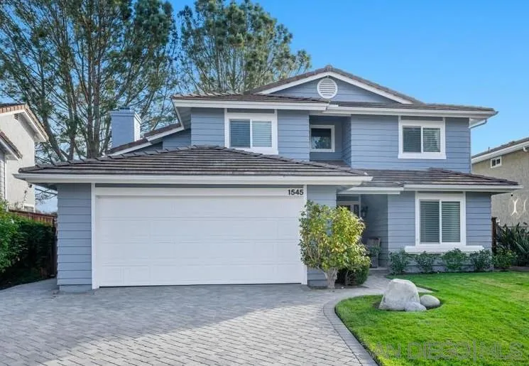 1545 Calle Ryan Encinitas, CA 92024 - Photo 3 of 63 a front view of a house with a yard