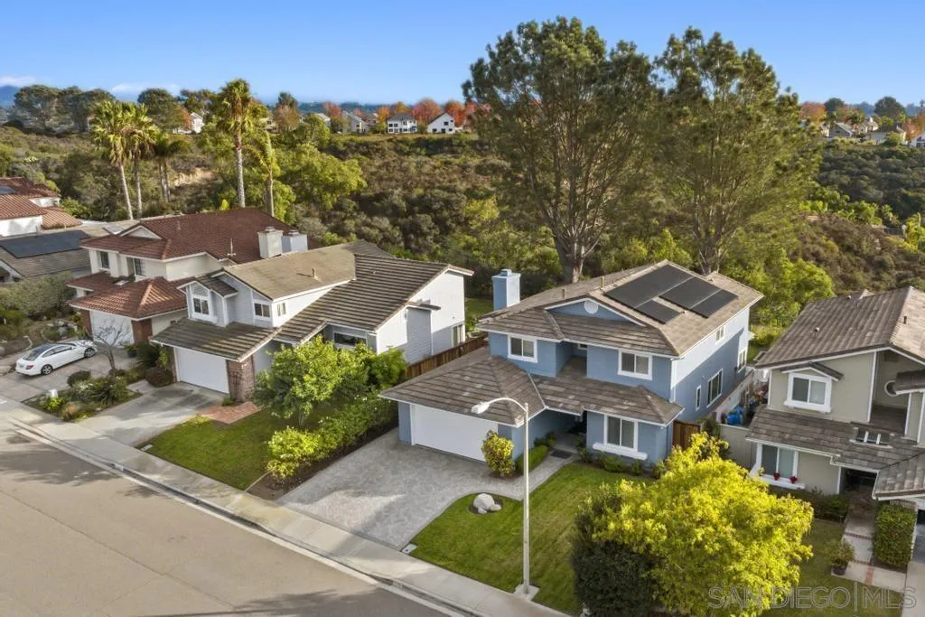 1545 Calle Ryan Encinitas, CA 92024 - Photo 31 of 63 a front view of a residential apartment building with a garden