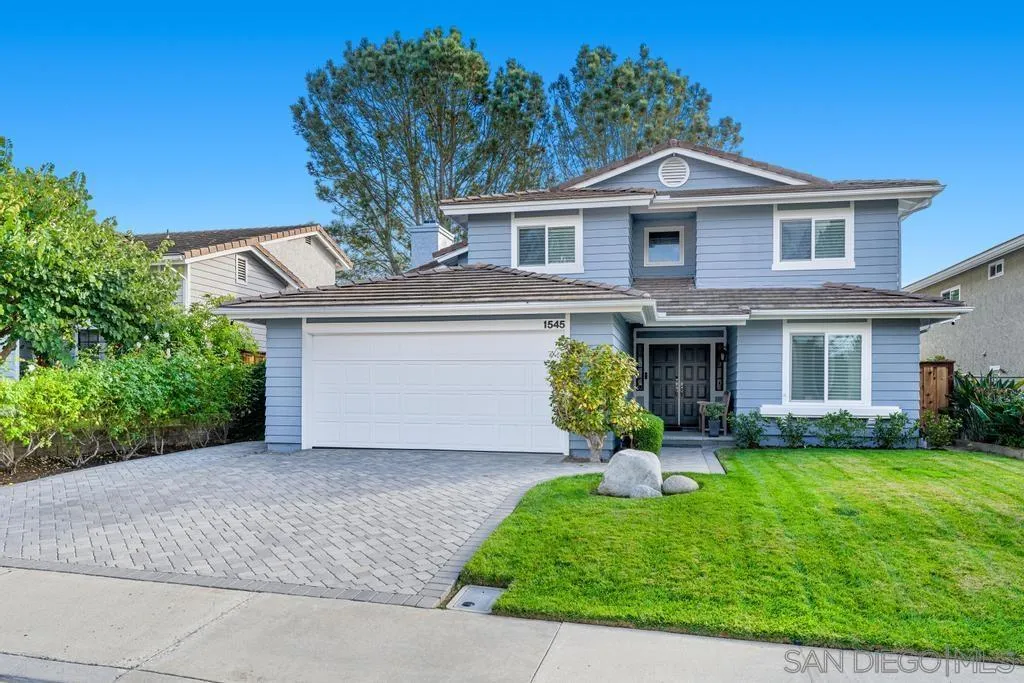 1545 Calle Ryan Encinitas, CA 92024 - Photo 60 of 63 a front view of a house with a garden and plants