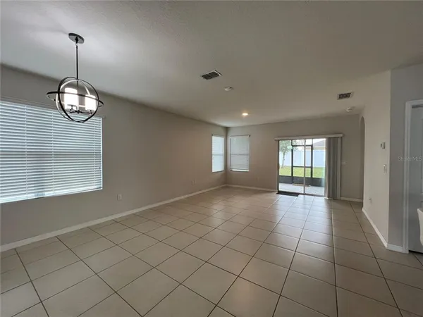 a kitchen with stainless steel appliances granite countertop a sink stove microwave and refrigerator