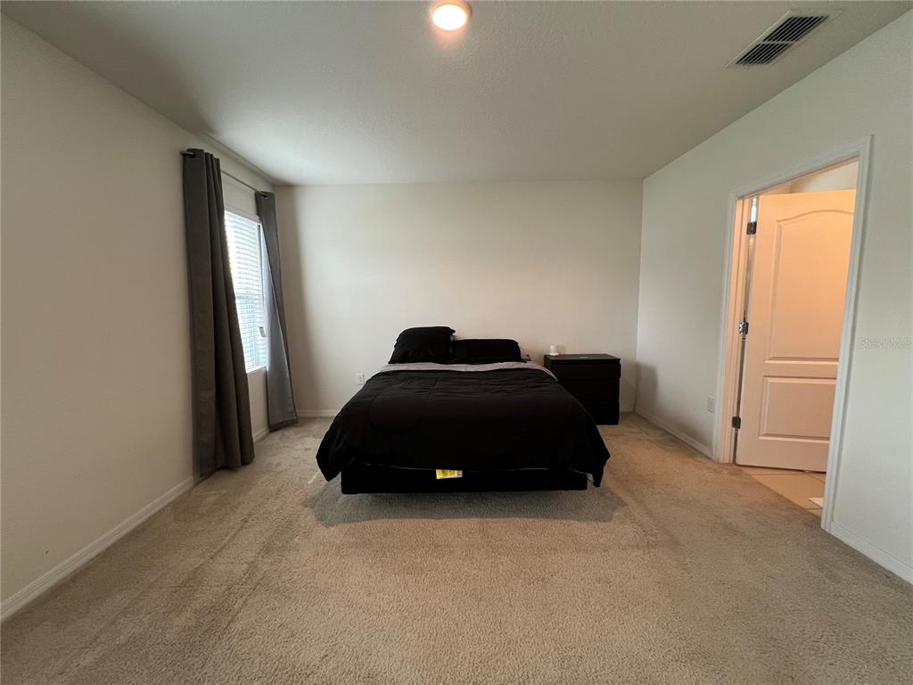 1756 Brockridge Road Kissimmee, FL 34744 - Photo 17 of 26 a car parked in a room