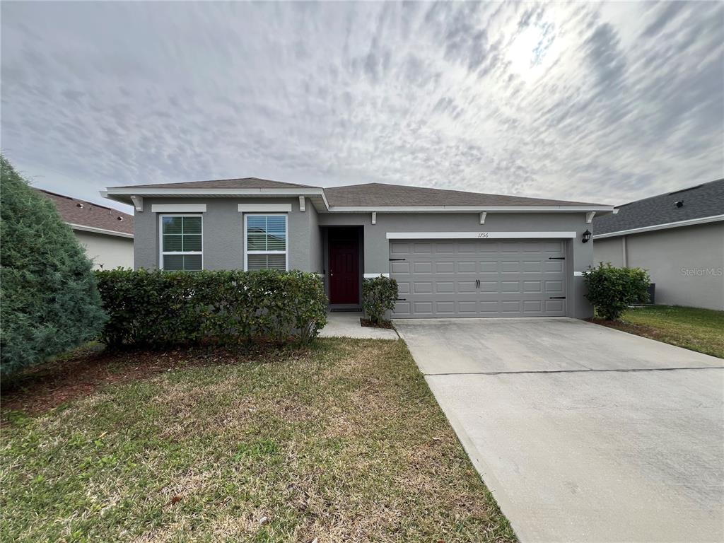 1756 Brockridge Road Kissimmee, FL 34744 - Photo 2 of 26 a house view with a outdoor space