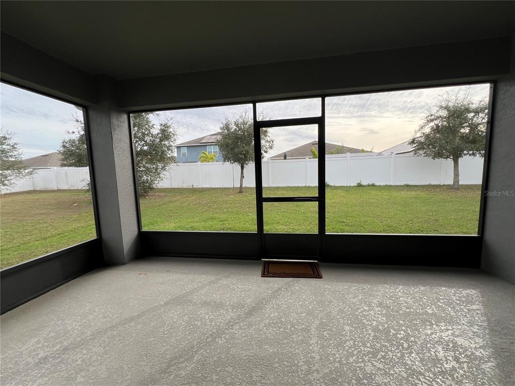 1756 Brockridge Road Kissimmee, FL 34744 - Photo 22 of 26 a view of an empty room with a floor to ceiling window