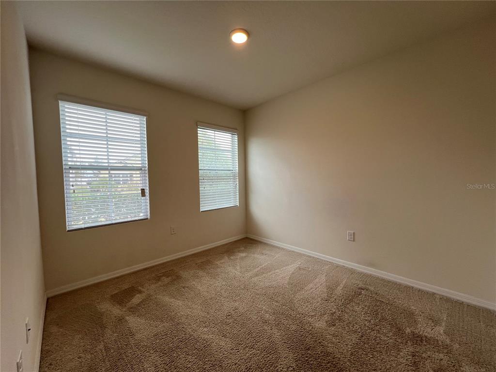1756 Brockridge Road Kissimmee, FL 34744 - Photo 5 of 26 an empty room with windows