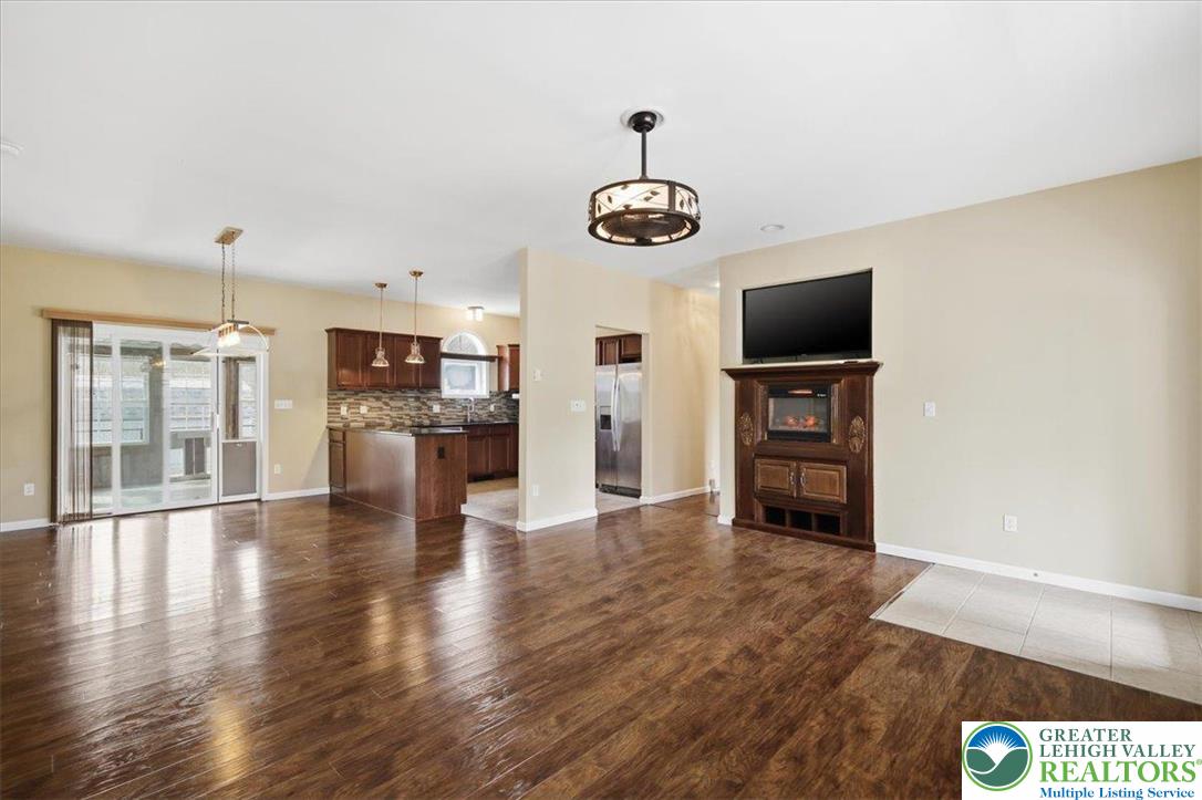 64 Robertson Road Jim Thorpe, PA 18229 - Photo 53 of 54 a view of an empty room with wooden floor and a kitchen