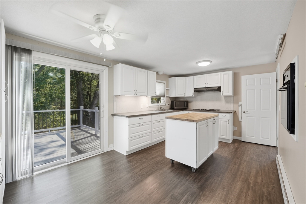 794 Homestead Avenue Holyoke, MA 01040 - Photo 11 of 34 a kitchen with white cabinets and white appliances