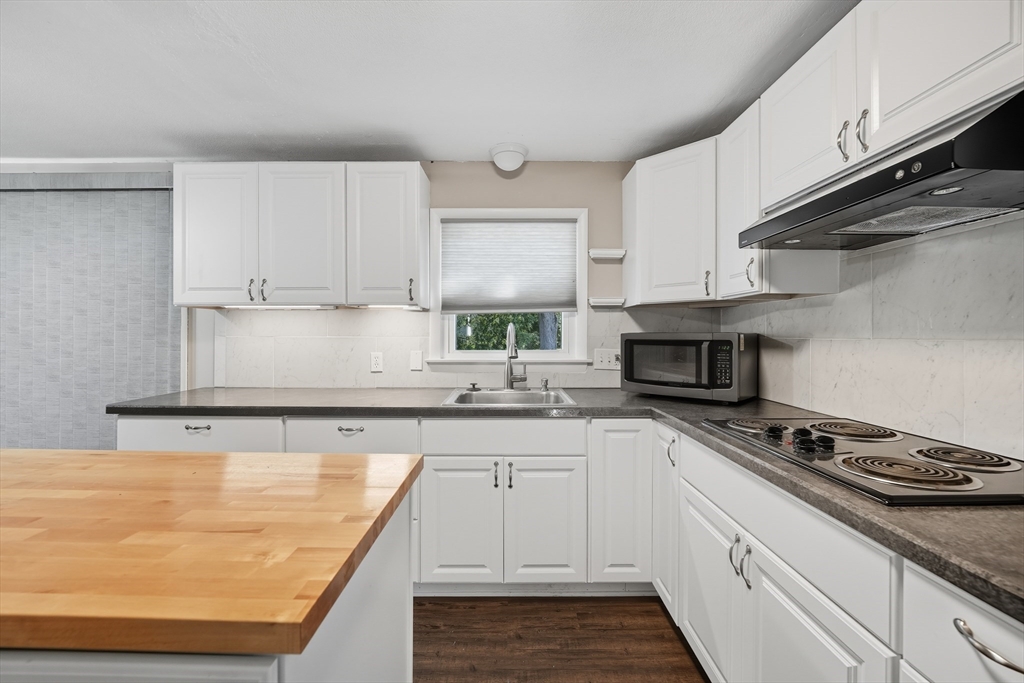 794 Homestead Avenue Holyoke, MA 01040 - Photo 12 of 34 a kitchen with stainless steel appliances a sink a stove and cabinets