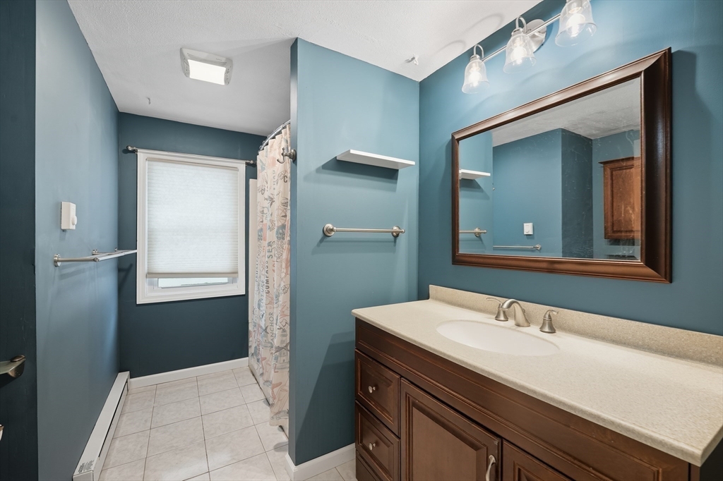 794 Homestead Avenue Holyoke, MA 01040 - Photo 16 of 34 a bathroom with a sink and a mirror
