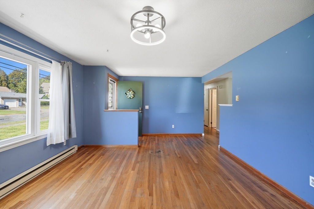 794 Homestead Avenue Holyoke, MA 01040 - Photo 17 of 34 a view of empty room with wooden floor and fan