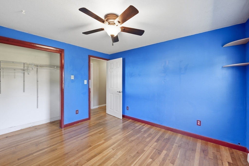 794 Homestead Avenue Holyoke, MA 01040 - Photo 22 of 34 an empty room with wooden floor and windows