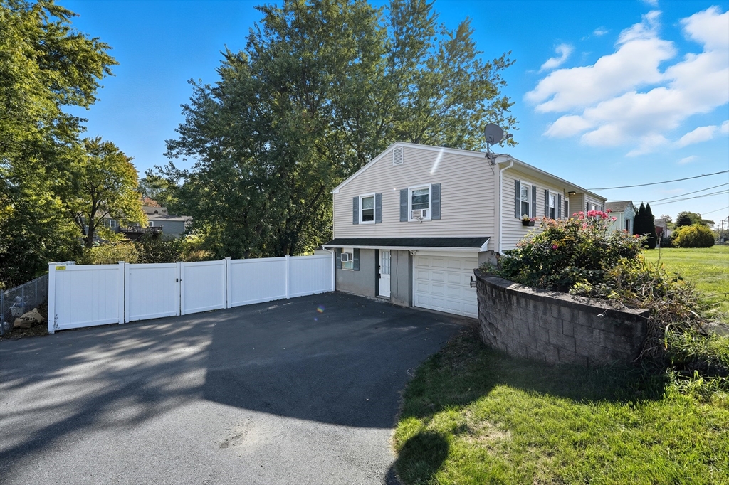 794 Homestead Avenue Holyoke, MA 01040 - Photo 4 of 34 a house view with a garden space
